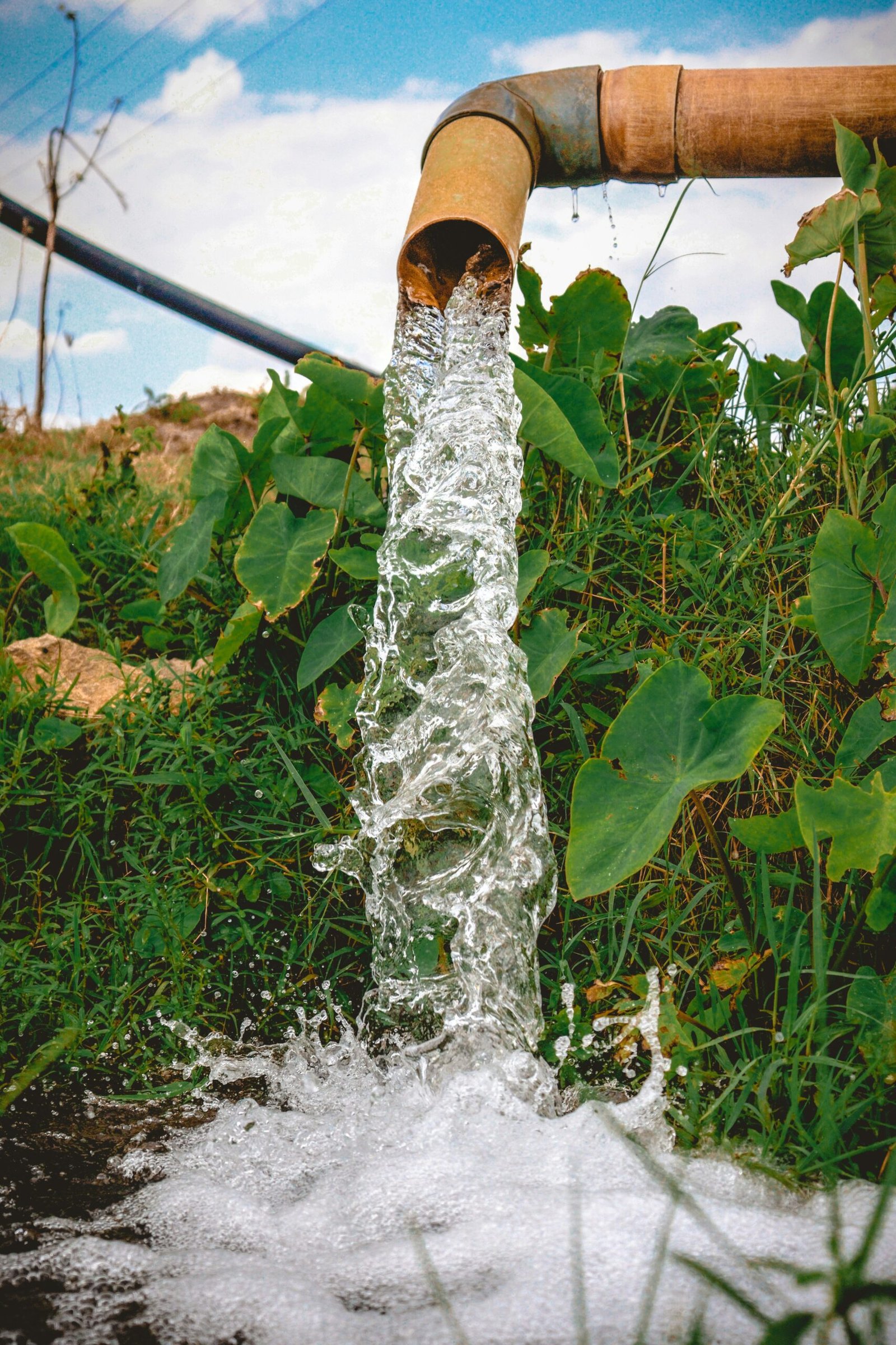 a pipe that has water coming out of it